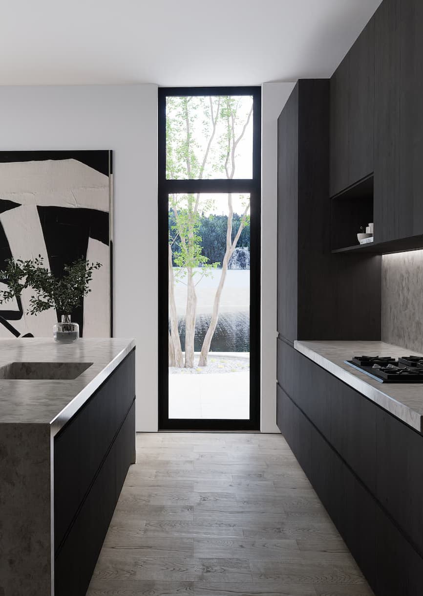 Scandinavian-style kitchen interior with cabinets, a kitchen island, and a floor-to-ceiling window revealing surrounding nature.